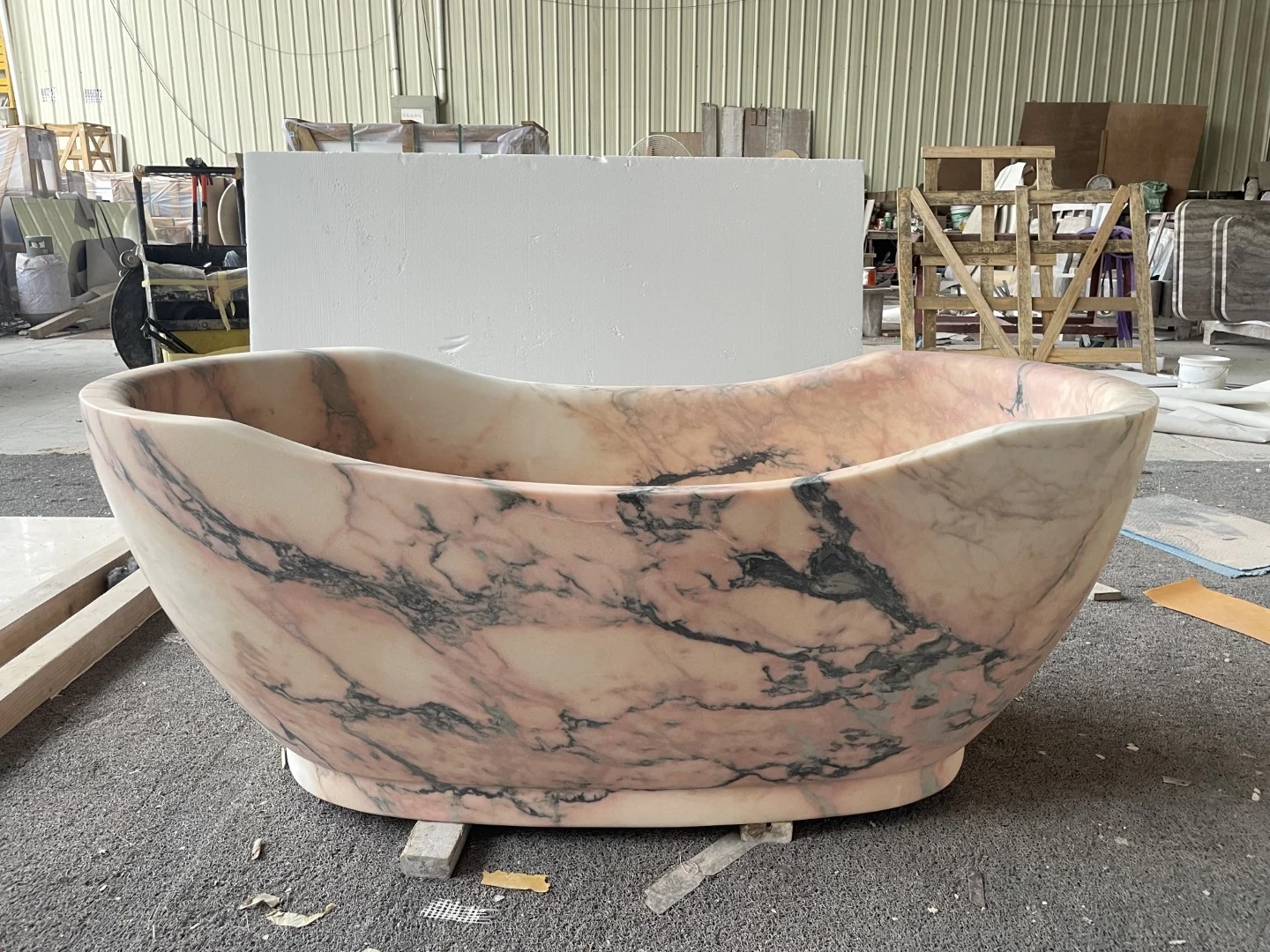 Calacatta Rosa marble freestanding bathtub carved from natural pink marble with dramatic dark gray veining and a sculpted oval form. Calacatta Rosa marble freestanding bathtub carved from natural pink marble with dramatic dark gray veining and a sculpted oval form.